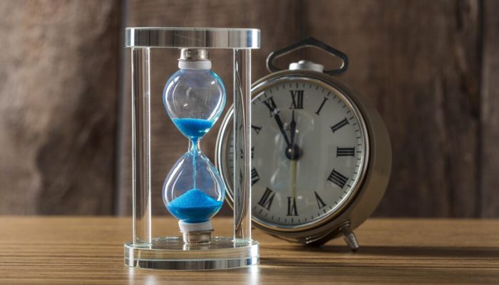 time-is-passing-blue-hourglass-close-up_93675-129822